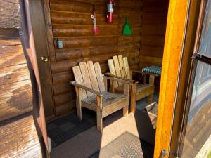 A picture of the porch with lounge chairs inside the Bay Cabin (Number 1)